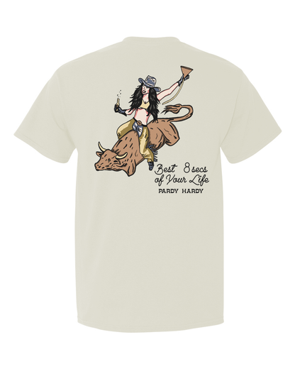 Introducing our electrifying tee that's hotter than a Texas rodeo: behold, a sizzling cowgirl mastering the art of bull riding! But wait, there's more – flip to the back and behold the words that'll leave you hanging onto the saddle: "The best eight seconds of your life."